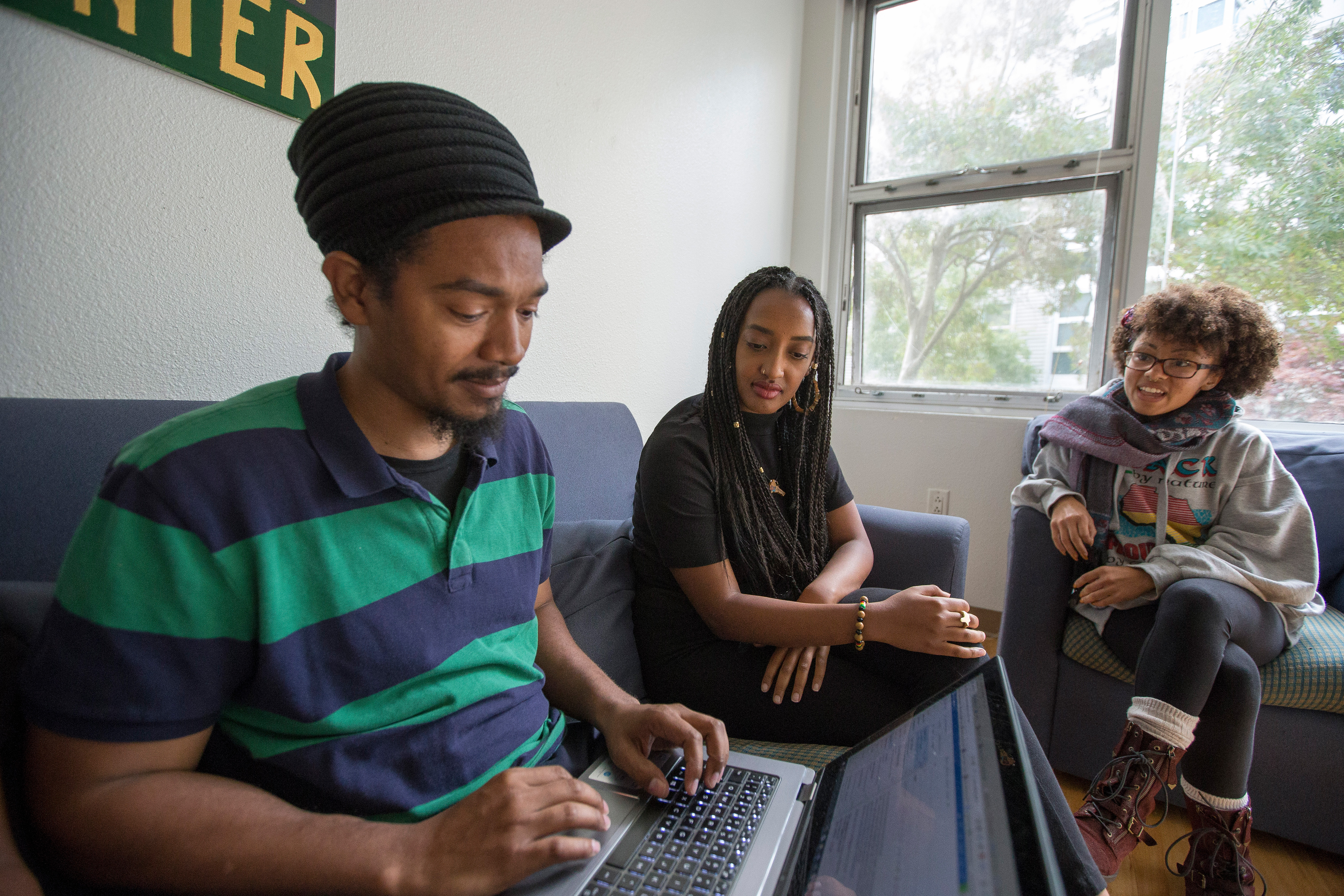 Three people are having discussion