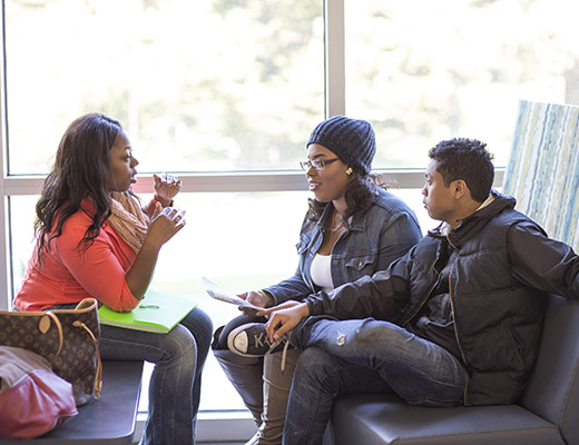 Three students having a discussion