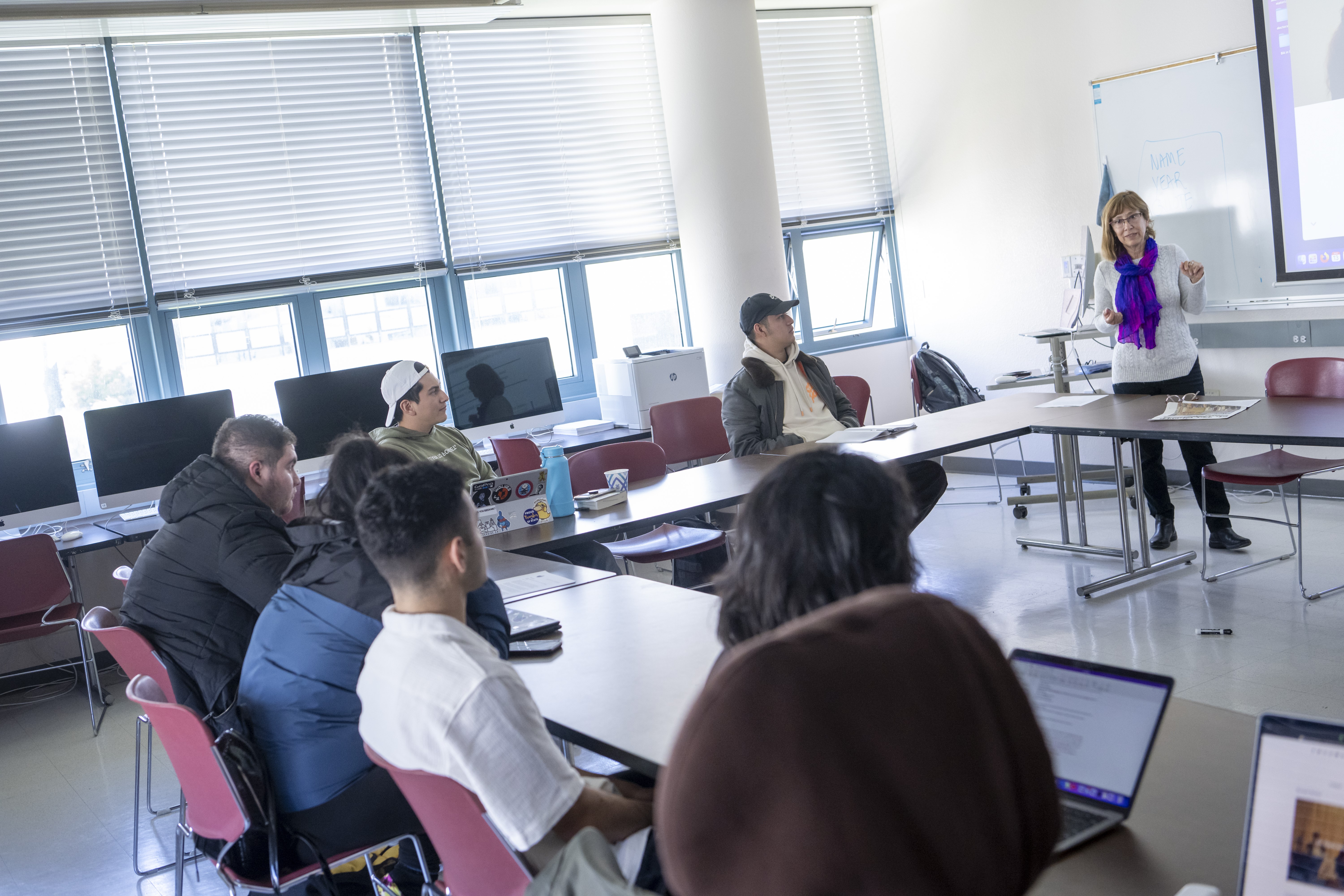 A faculty teaching in a classroom