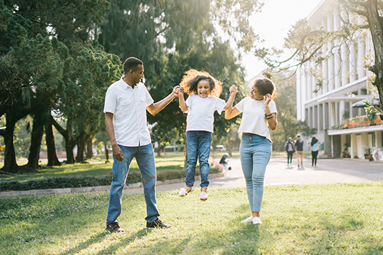 Parents and a daughter at the park