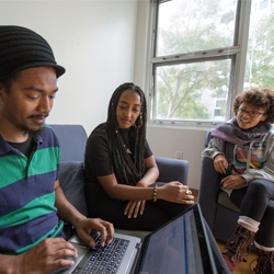 Three people are having discussion